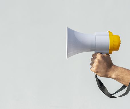 hand holding megaphone protest. High quality beautiful photo concept