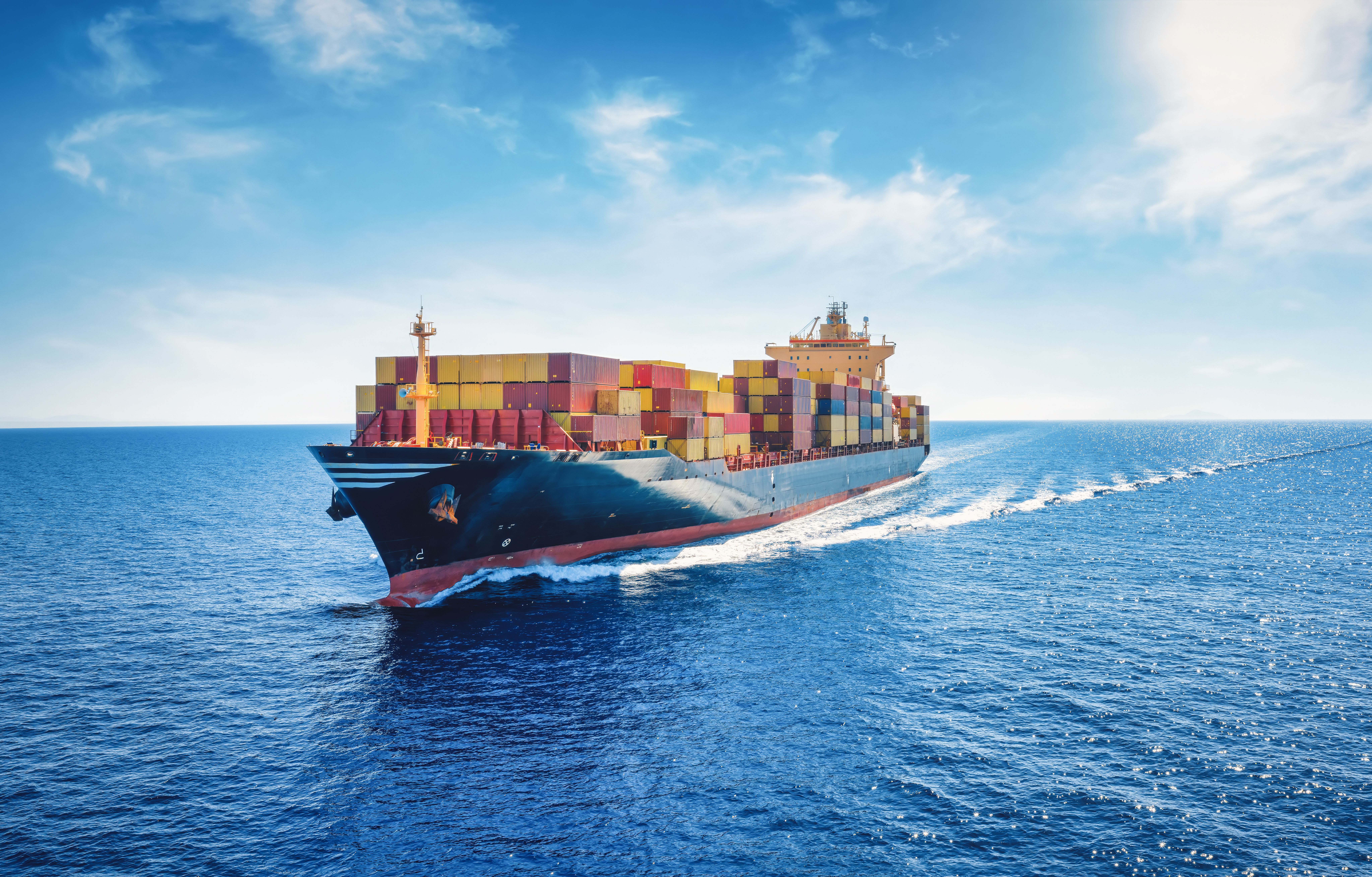 picture: cargo ship carrying container for import and export, business logistic and transportation in open sea with copy space