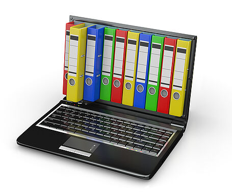 Darstellung eines Laptop mit bunten Ordnerrücken auf dem Bildschirm